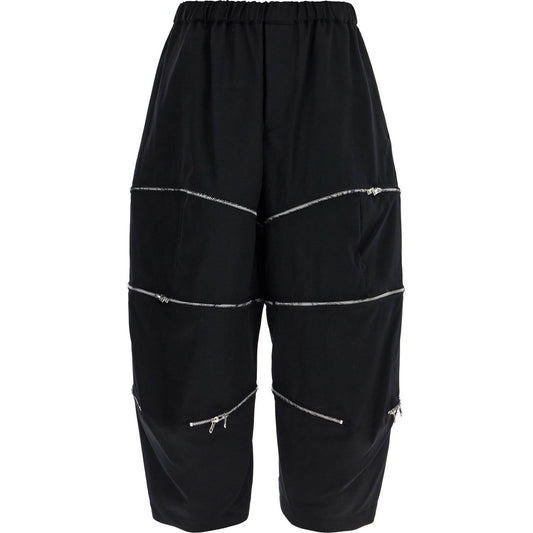 COMME DES GARCONS BLACK cropped pants with zip openings.